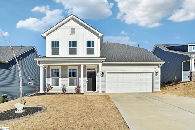 view of front of home featuring a garage, a front lawn, and a porch