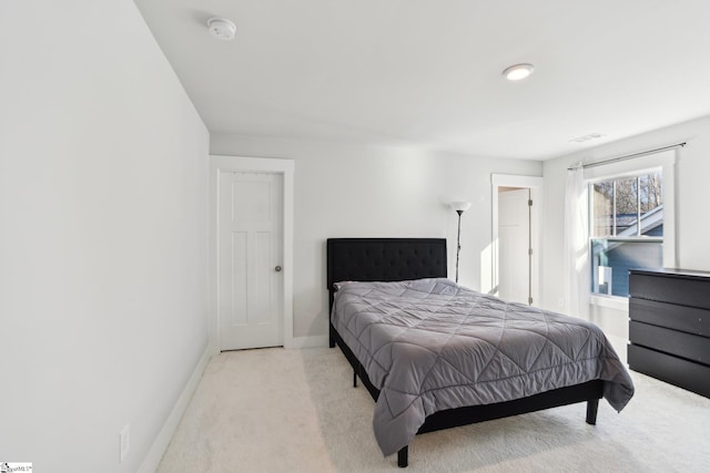 bedroom with light colored carpet