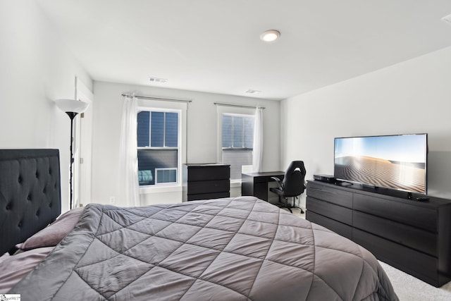 bedroom featuring light colored carpet