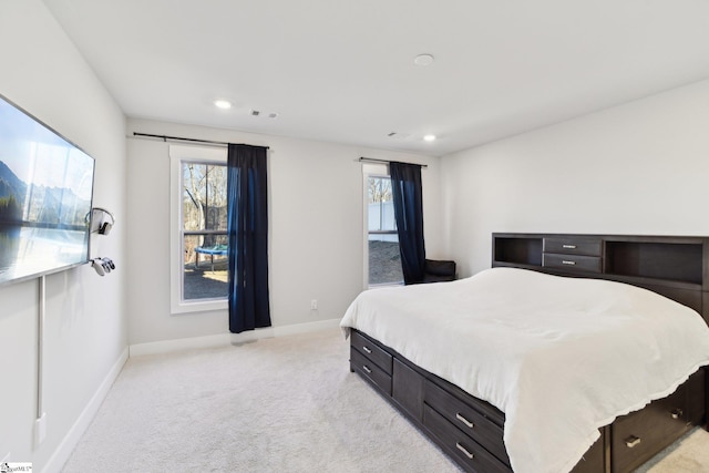 bedroom with light colored carpet