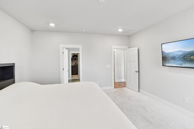 bedroom featuring light colored carpet