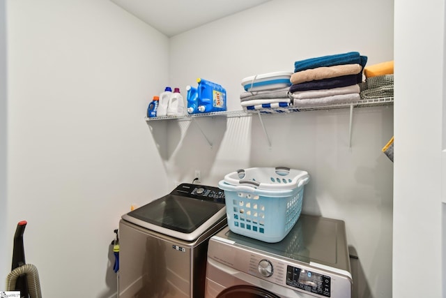 laundry room with independent washer and dryer