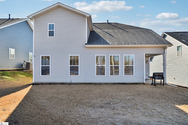 back of house featuring central AC