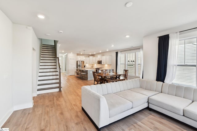 living room with light hardwood / wood-style floors