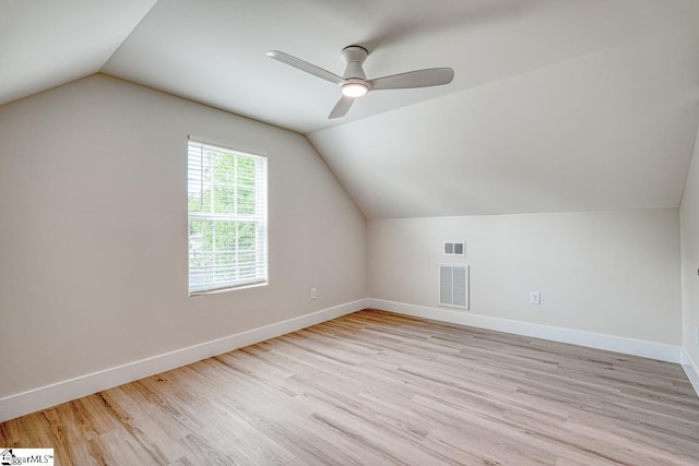 bonus room featuring ceiling fan, lofted ceiling, and light wood-type flooring