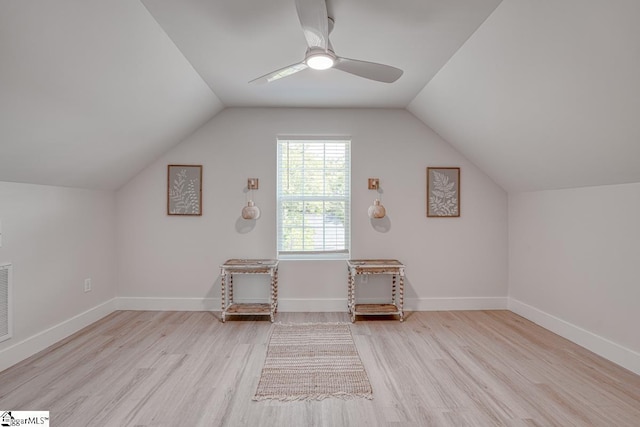 bonus room featuring ceiling fan, lofted ceiling, and light wood-type flooring