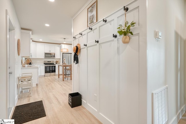 interior space with light hardwood / wood-style flooring