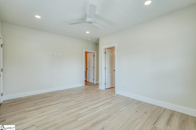 unfurnished room with ceiling fan and light hardwood / wood-style flooring