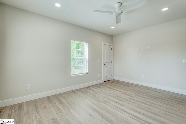 empty room featuring ceiling fan and light wood-type flooring