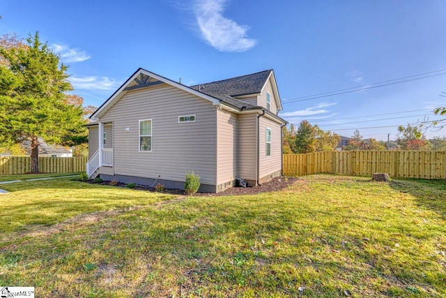 view of property exterior with a yard