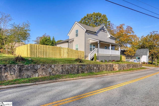 view of property exterior with a porch