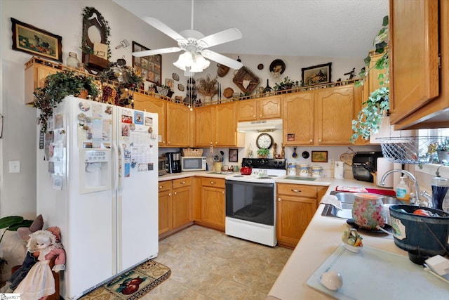 kitchen featuring ceiling fan, sink, a textured ceiling, and white appliances