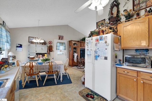 kitchen featuring pendant lighting, white fridge with ice dispenser, a textured ceiling, ceiling fan with notable chandelier, and vaulted ceiling