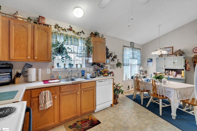 kitchen with a wealth of natural light, vaulted ceiling, pendant lighting, and white appliances