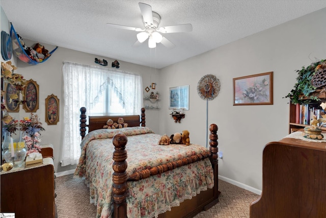 bedroom with a textured ceiling and ceiling fan