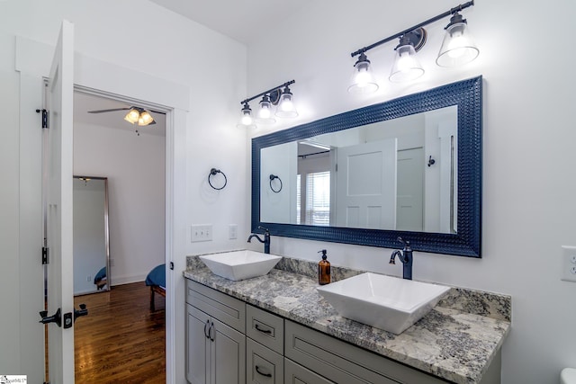 bathroom featuring vanity, hardwood / wood-style flooring, and ceiling fan