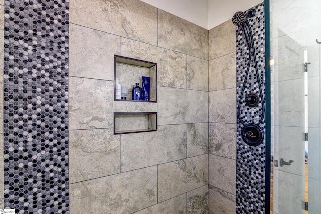 room details with a tile shower