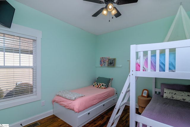 bedroom featuring dark wood-type flooring and ceiling fan