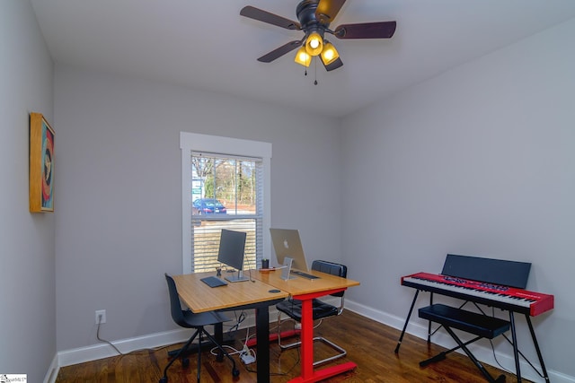 office area with ceiling fan and dark hardwood / wood-style floors