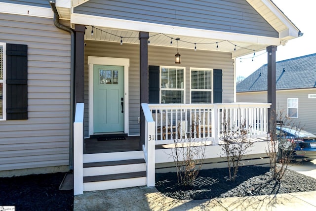 property entrance featuring covered porch