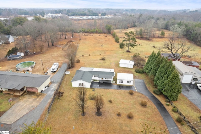 birds eye view of property featuring a rural view