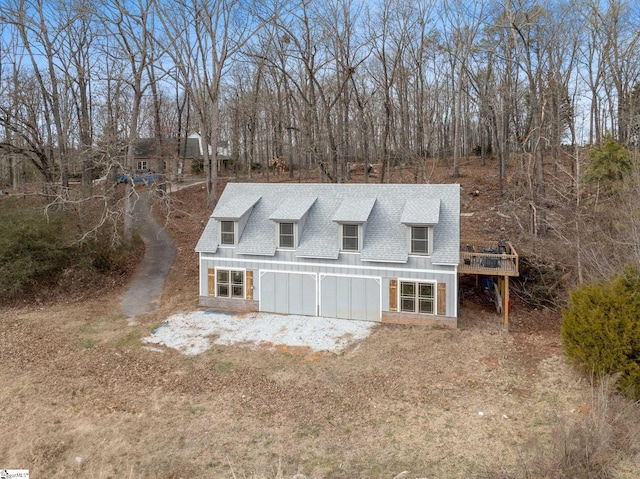 cape cod-style house featuring a deck