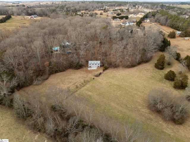 birds eye view of property with a rural view