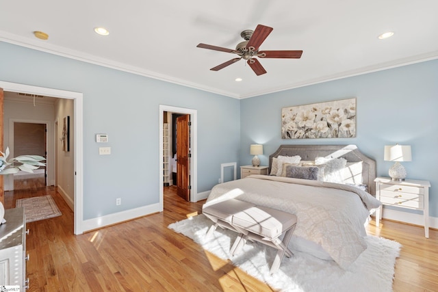 bedroom with ornamental molding, ceiling fan, and light hardwood / wood-style floors