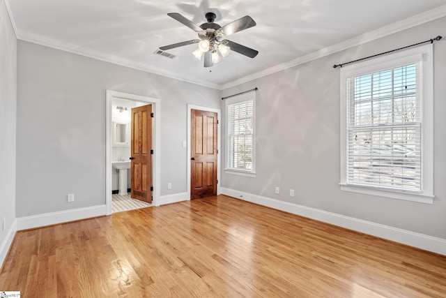 unfurnished bedroom with ensuite bathroom, sink, crown molding, light hardwood / wood-style flooring, and ceiling fan