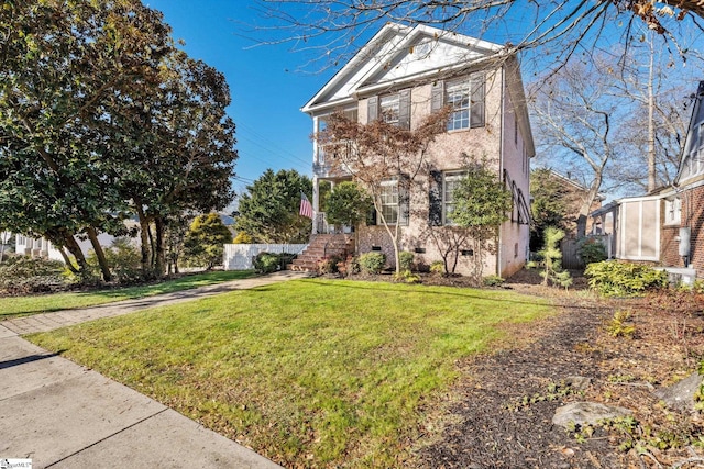 front facade with a front lawn