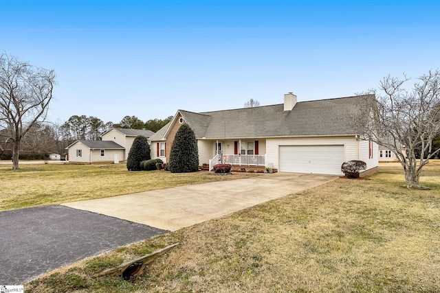 view of front facade with a garage, a front yard, and a porch