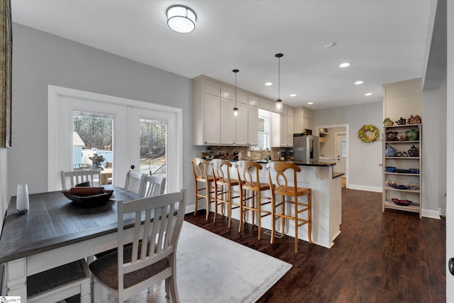 dining room featuring dark hardwood / wood-style floors and french doors