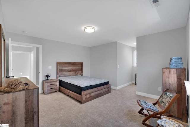 bedroom with light carpet