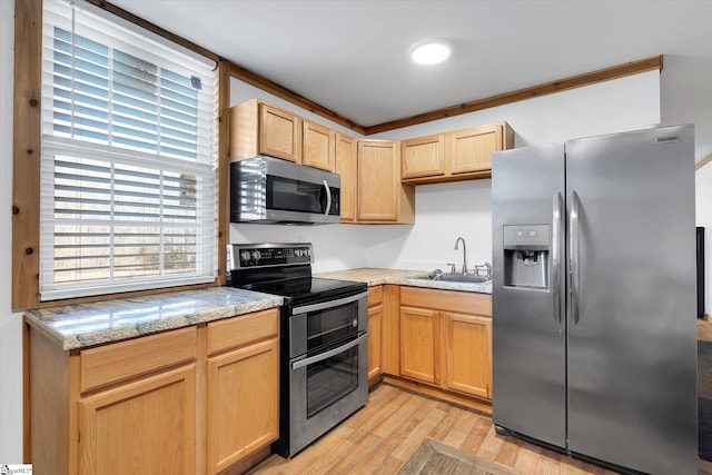 kitchen with sink, crown molding, light hardwood / wood-style flooring, appliances with stainless steel finishes, and light stone countertops