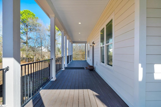 wooden terrace with a porch