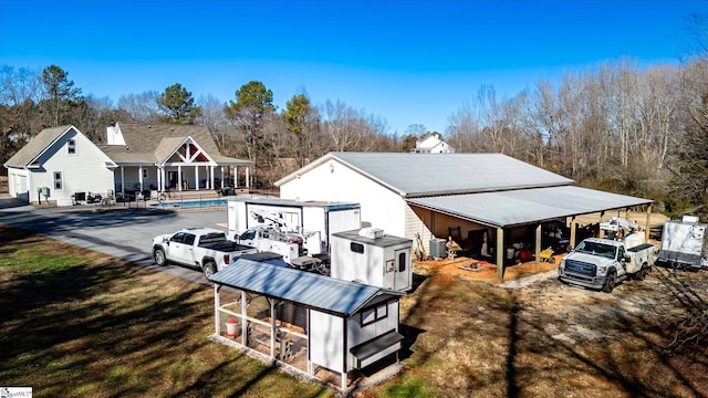 back of house featuring a yard and central AC unit