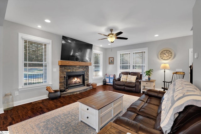 living room with hardwood / wood-style flooring, a fireplace, and ceiling fan