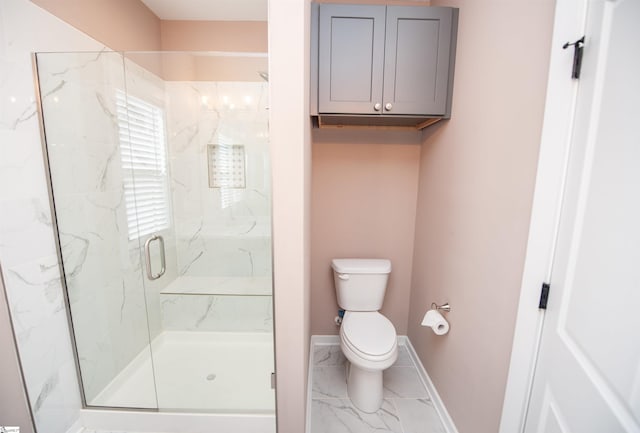 bathroom featuring walk in shower and toilet