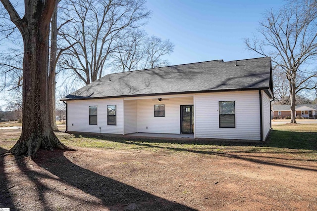 back of house with ceiling fan, a yard, and a patio