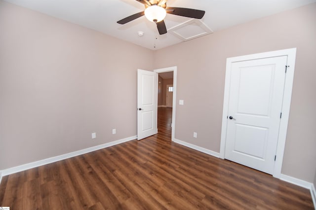 unfurnished bedroom featuring dark wood-type flooring and ceiling fan