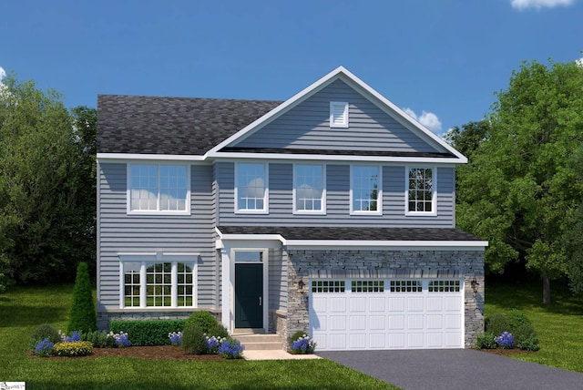 view of front facade featuring a garage and a front lawn