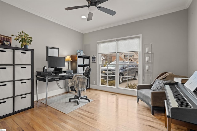 office featuring ceiling fan, ornamental molding, light hardwood / wood-style flooring, and a wealth of natural light