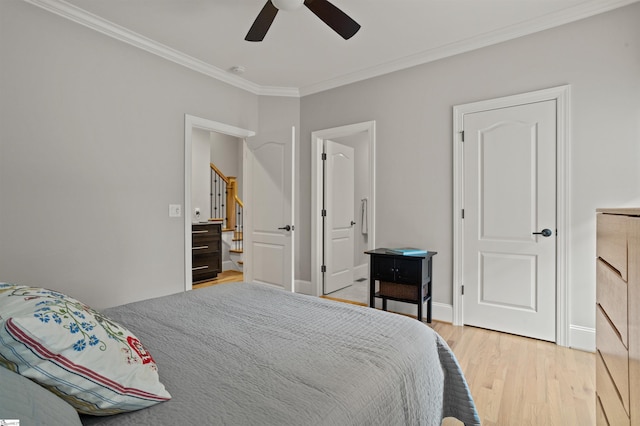 bedroom featuring ceiling fan, ornamental molding, and hardwood / wood-style floors