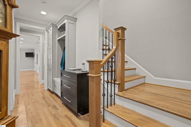 interior space featuring crown molding and hardwood / wood-style flooring