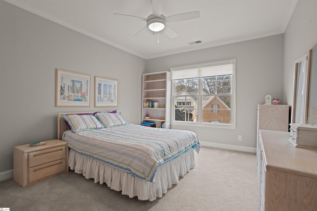 bedroom featuring ornamental molding, light carpet, and ceiling fan