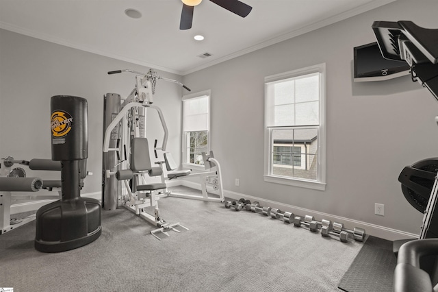 workout room featuring ornamental molding and ceiling fan