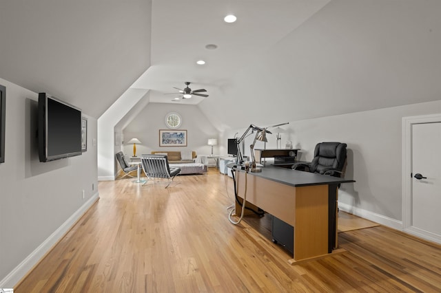 office space featuring ceiling fan, lofted ceiling, and light hardwood / wood-style floors