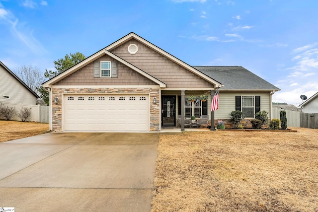 craftsman-style home featuring a front yard and covered porch