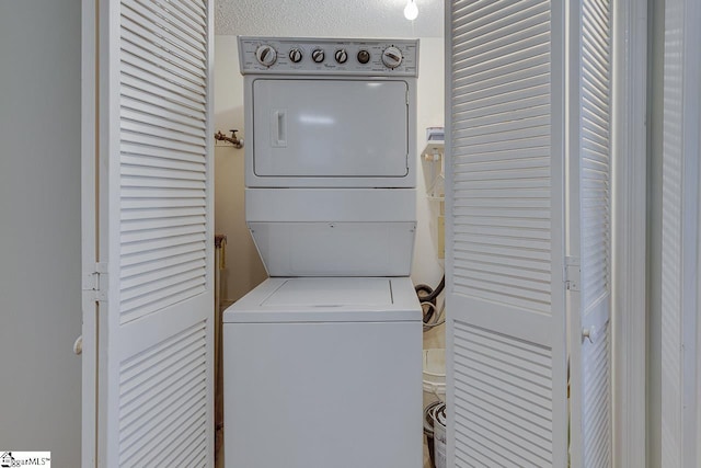 laundry area with stacked washer / drying machine