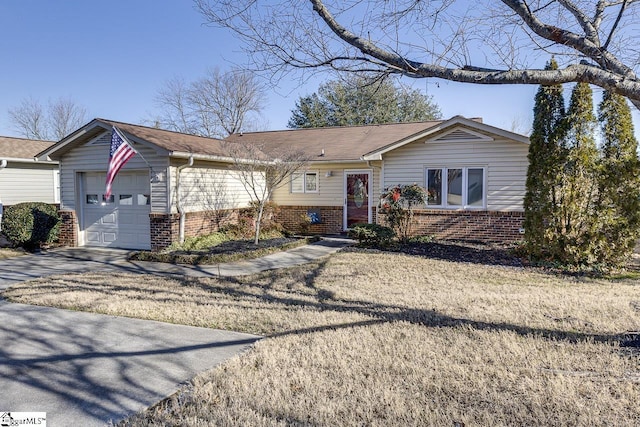 ranch-style home with a garage and a front yard